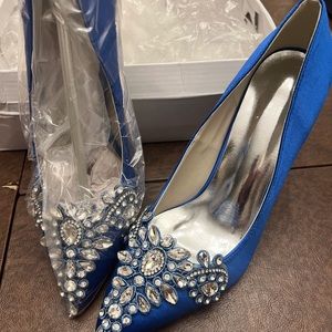 Blue fabric crystal pumps.
